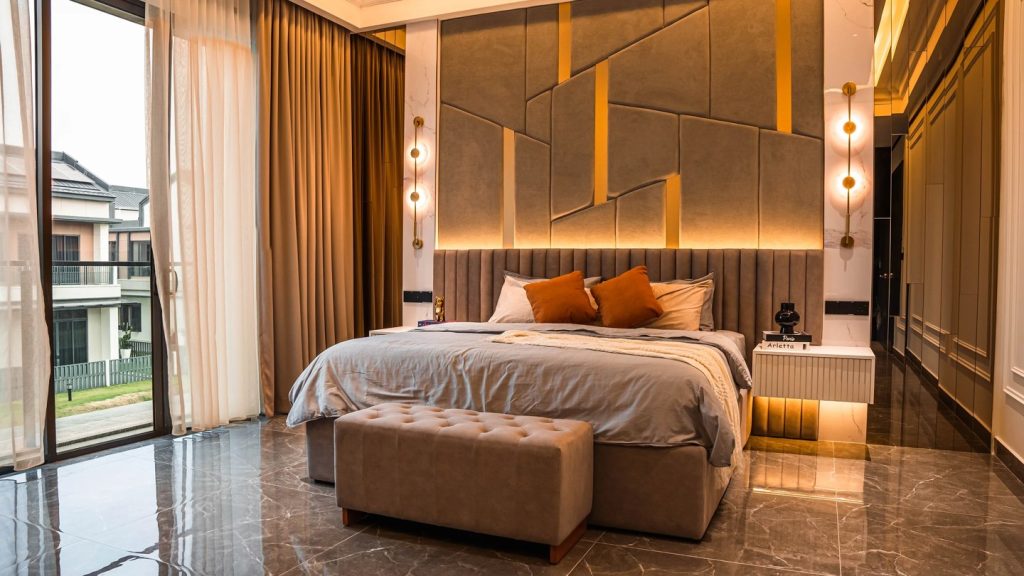 Master bedroom design in a Malaysian landed home — upholstered feature wall, layered lighting and a bench at the foot of the bed, Setia Marina One, Cyberjaya