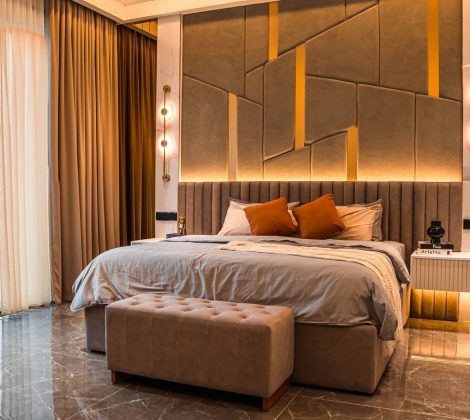 Master bedroom design in a Malaysian landed home — upholstered feature wall, layered lighting and a bench at the foot of the bed, Setia Marina One, Cyberjaya
