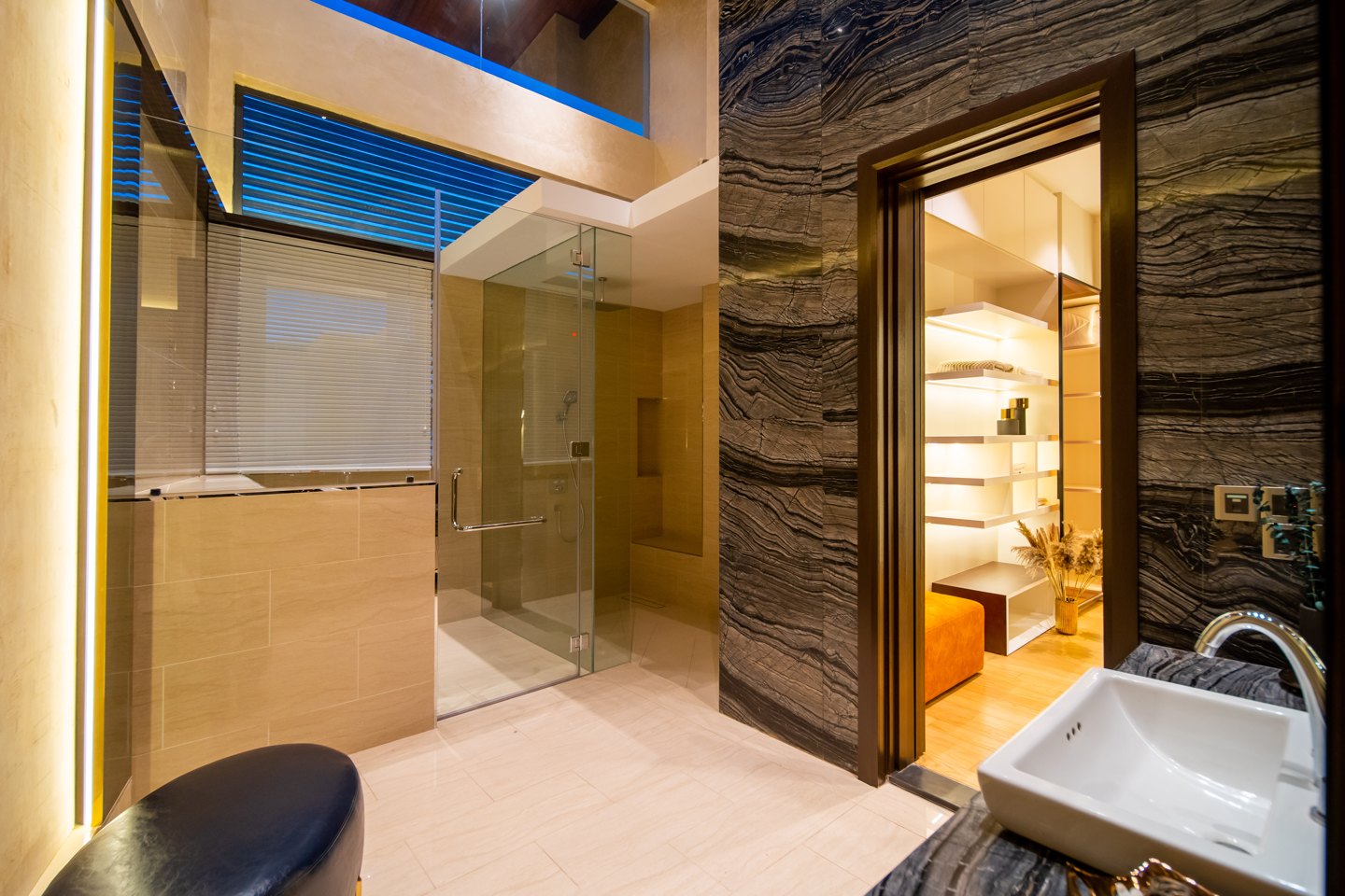 Bathroom with natural light from a full-height window reaching the sink through a glass shower wall, Bangsar bungalow