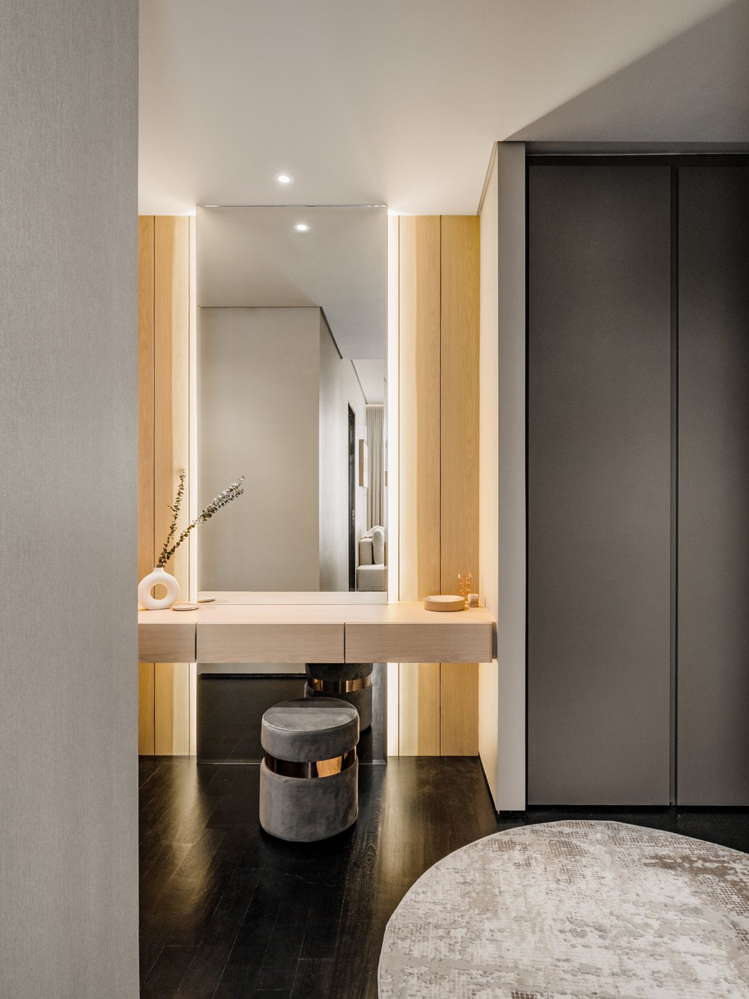Backlit dressing vanity in the passage to the ensuite at Four Seasons Place, Kuala Lumpur