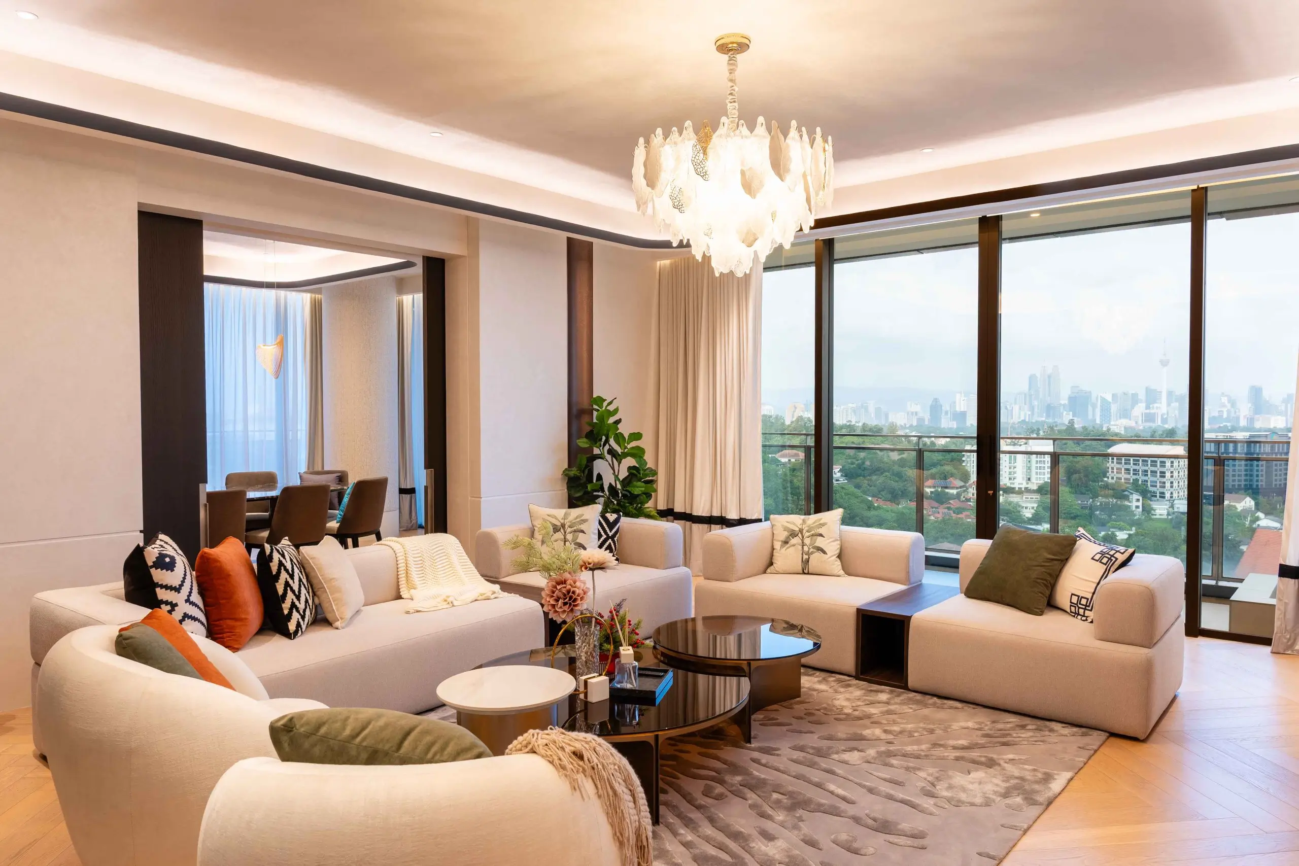 Contemporary interior design in Malaysia — curved seating and a warm neutral palette in a Kuala Lumpur living room, Aira Residence