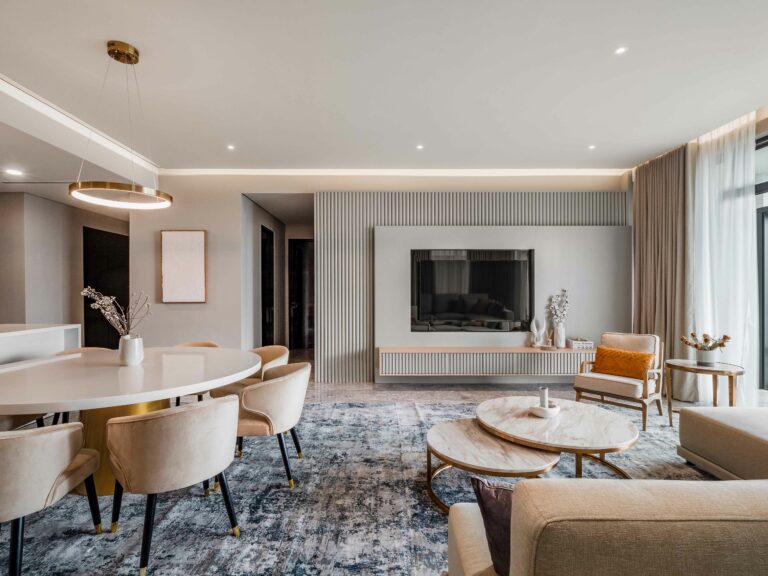 a luxury designed living room filled with exclusive custom furniture and large flat screen tv in four season residence KL, interior design by Blaine Robert Design