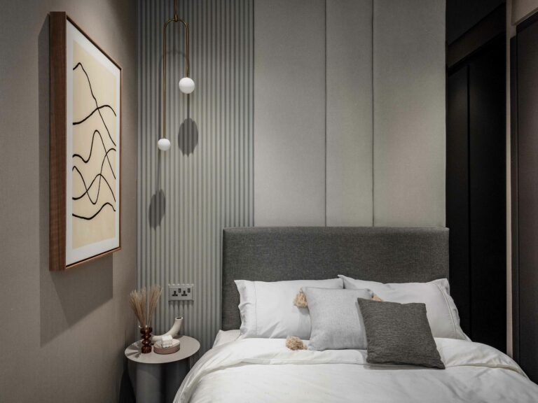 a guest room bed with white sheets and pillows in four seasons residence, KL, interior design by Blaine Robert Design