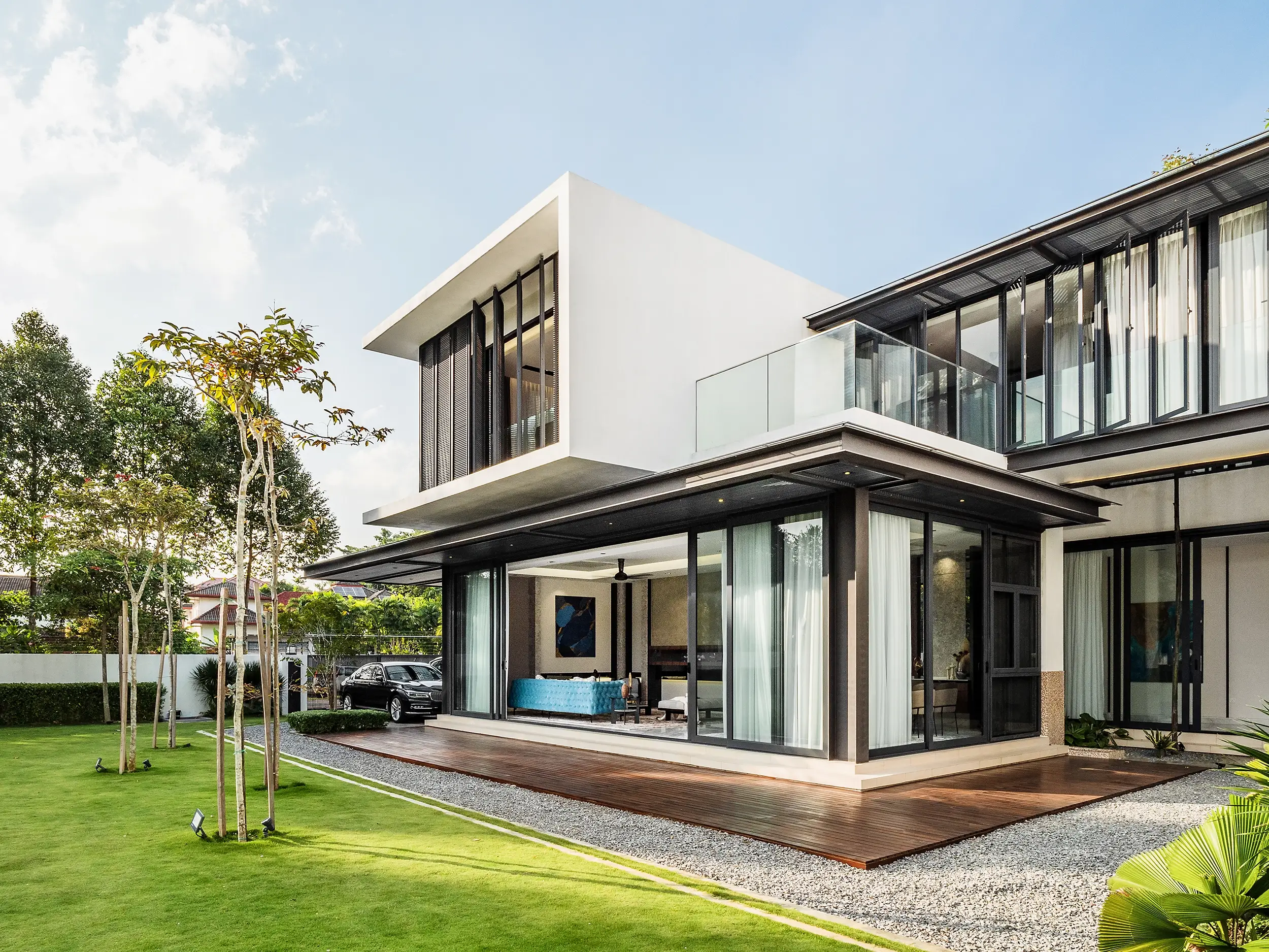 Tropical biophilic design in Malaysia — a Kelana Jaya bungalow opening to garden and pool behind deep overhangs
