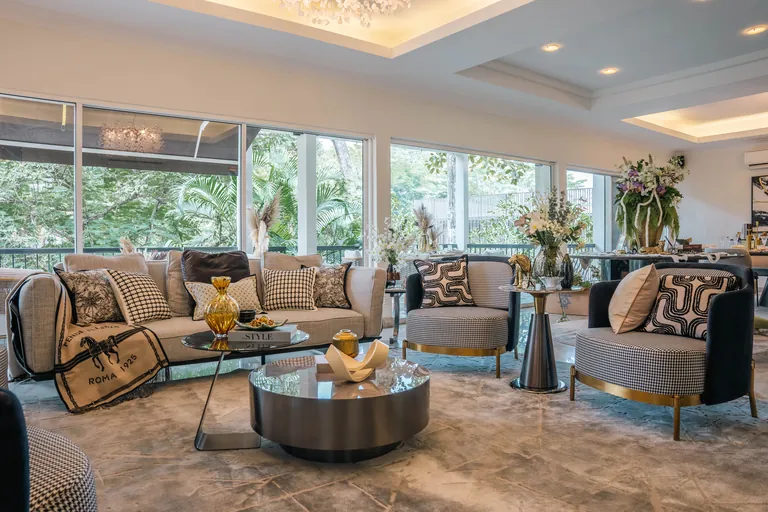 Bukit Tunku Residence, Kuala Lumpur: living room with garden views through full-height glass