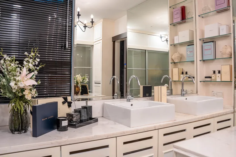 Bukit Tunku Residence, Kuala Lumpur: bathroom vanity with twin basins and styled shelves