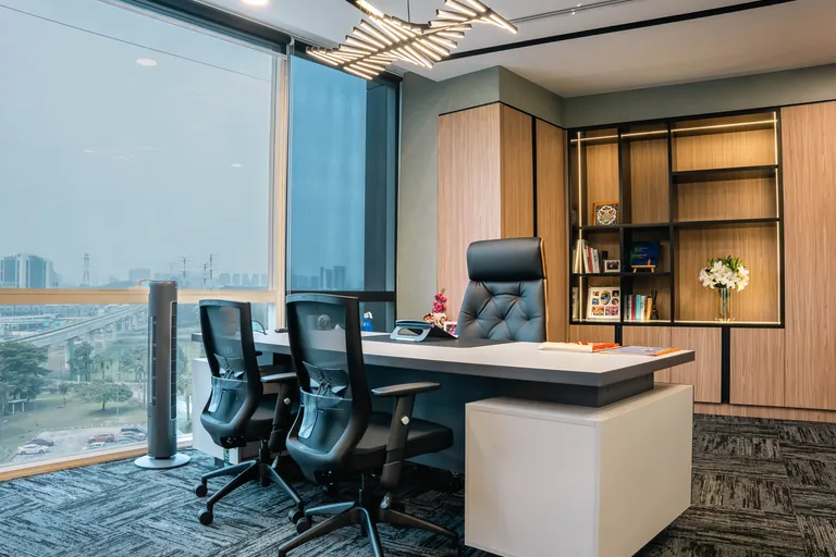 Persada PLUS Office, Petaling Jaya: director's room with timber joinery and a city view