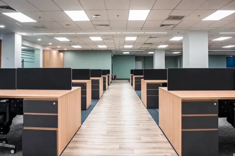 Persada PLUS Office, Petaling Jaya: open-plan office with a timber-floored central walkway