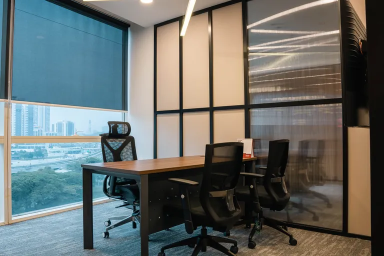 Persada PLUS Office, Petaling Jaya: private office behind black-framed glass partitions