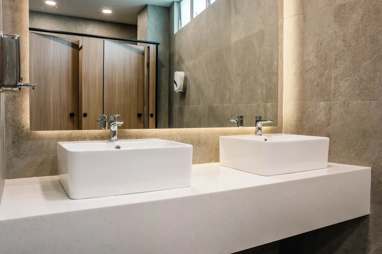 Persada PLUS Office, Petaling Jaya: washroom with stone-look walls and twin basins