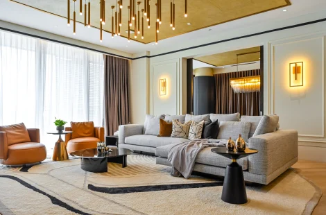 Living room with gold-leaf ceiling at Aira Residence by Blaine Robert Design