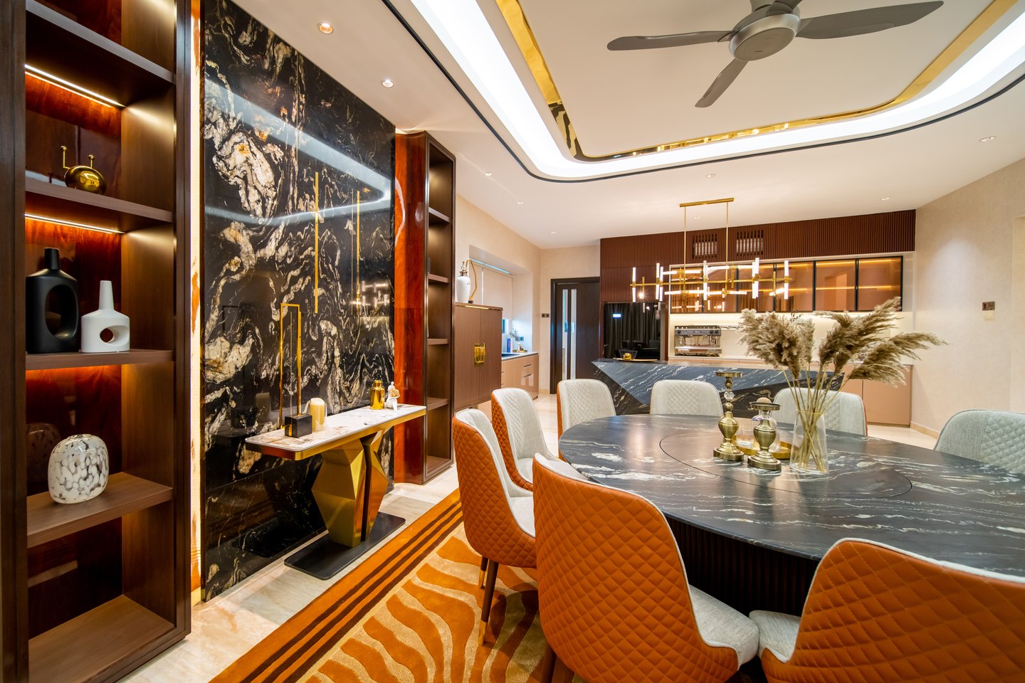 Formal dining feature wall in black marble and timber display shelving in a Bangsar bungalow