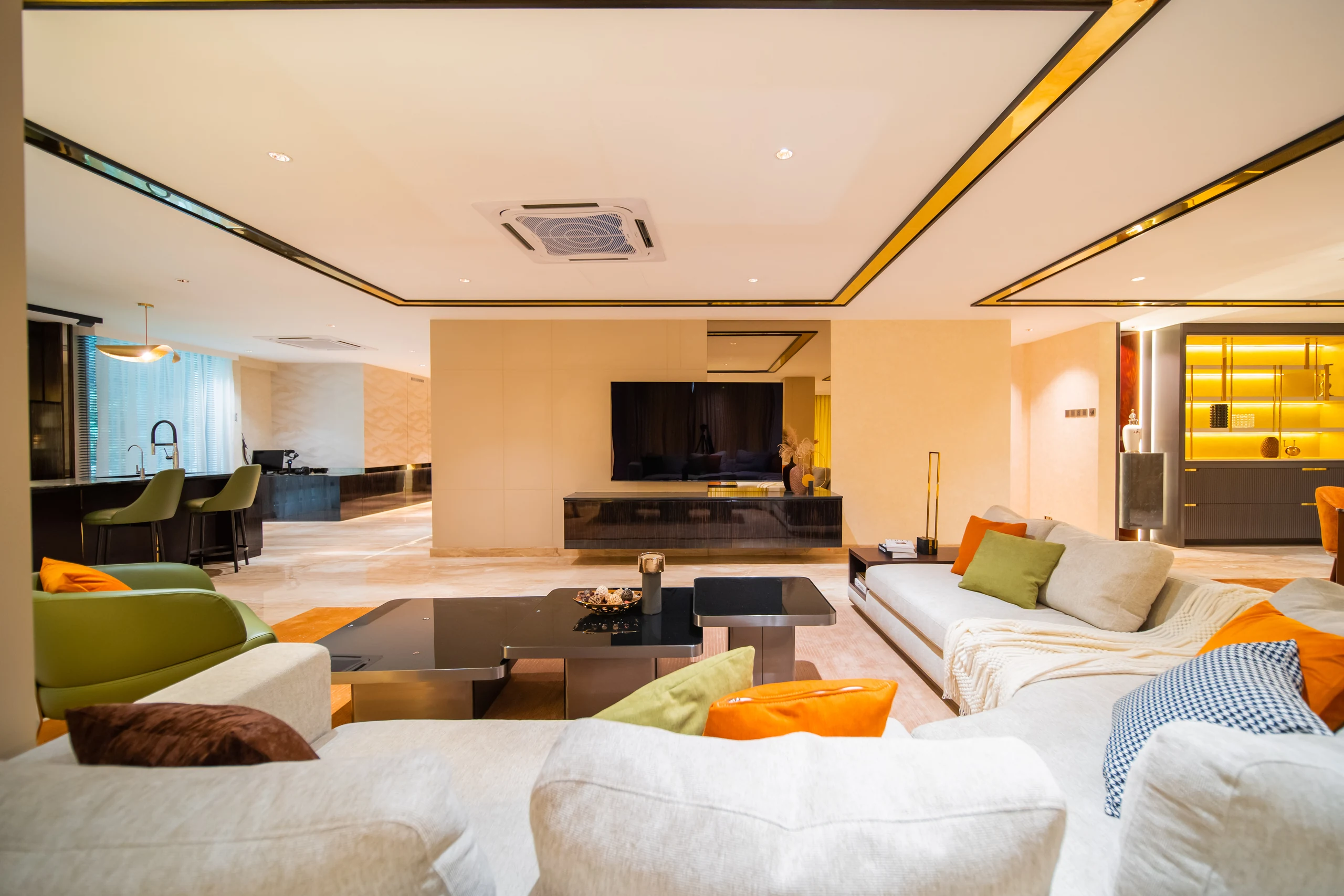 Living hall of a Bangsar bungalow opening to a floating TV console and bar counter.