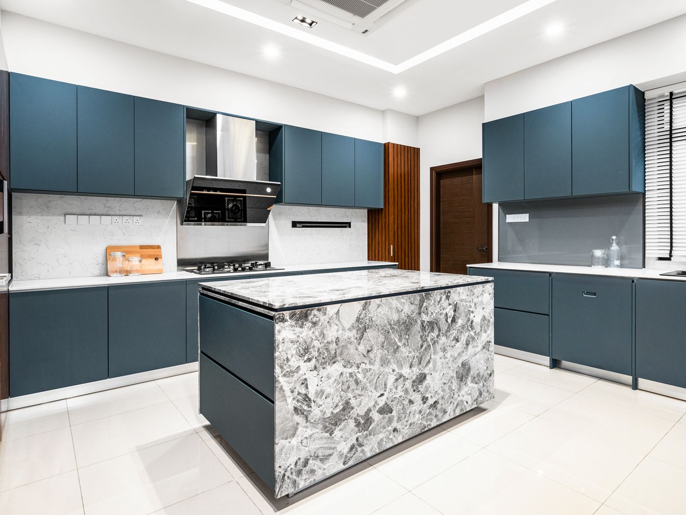 Blue cabinetry kitchen in a completed Malaysian bungalow renovation