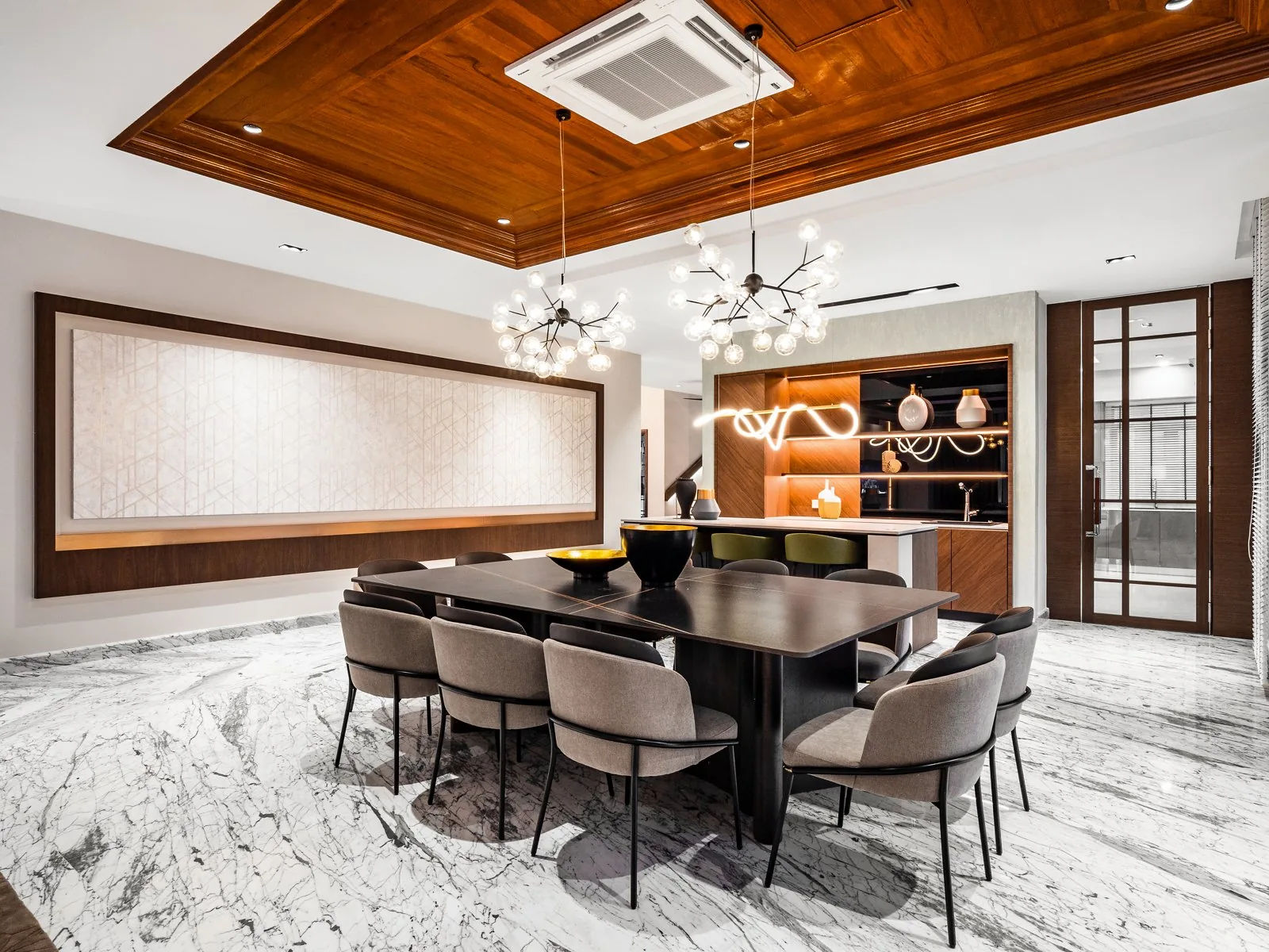 Timber-lined tray ceiling with two chandeliers over the dining room of the Terengganu bungalow