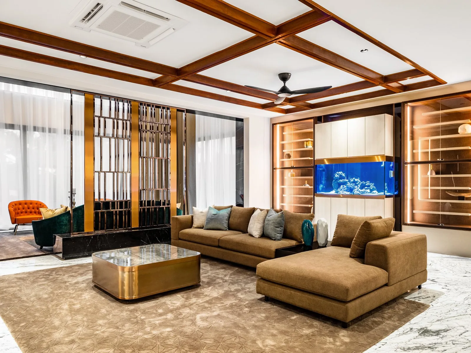 Coffered ceiling with a timber grid over the living room of a Terengganu bungalow by Blaine Robert Design