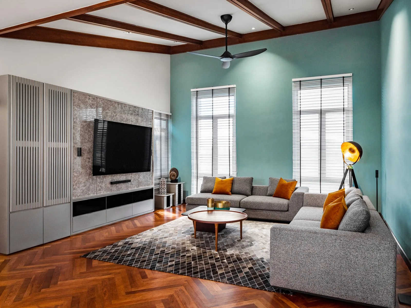 Exposed timber beams across a white ceiling in the family room of the Terengganu bungalow