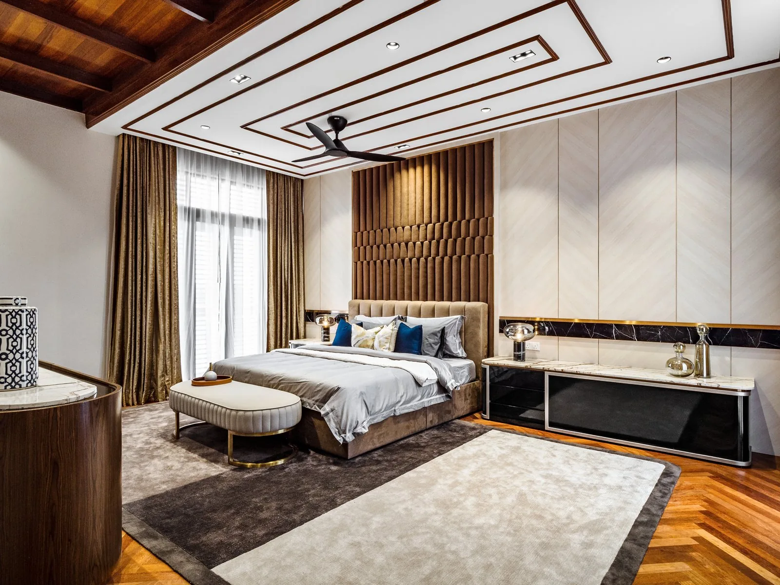 Stepped geometric ceiling with white stripes over the master bedroom of the Terengganu bungalow
