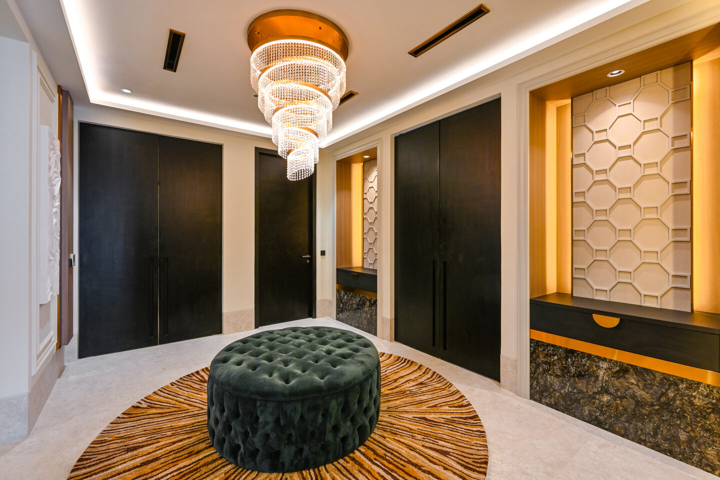 Condo foyer with full-height cabinetry and concealed storage