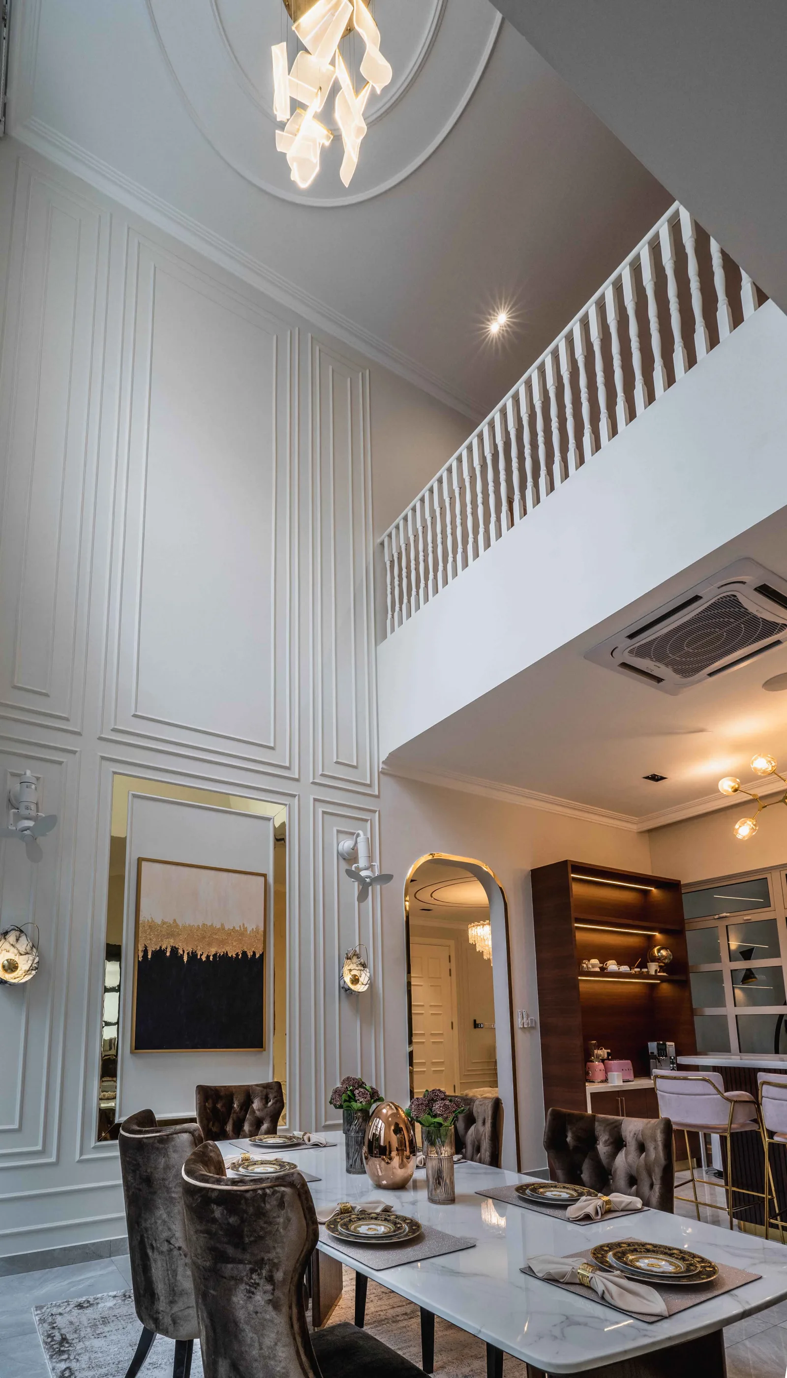 Double-volume dining room with an upper-floor gallery and balustrade above, EcoSpring Villa, Tebrau, Johor Bahru