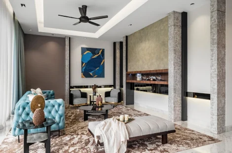 Armchairs facing the sofa in a conversation layout, Kelana Jaya bungalow living hall with media wall.