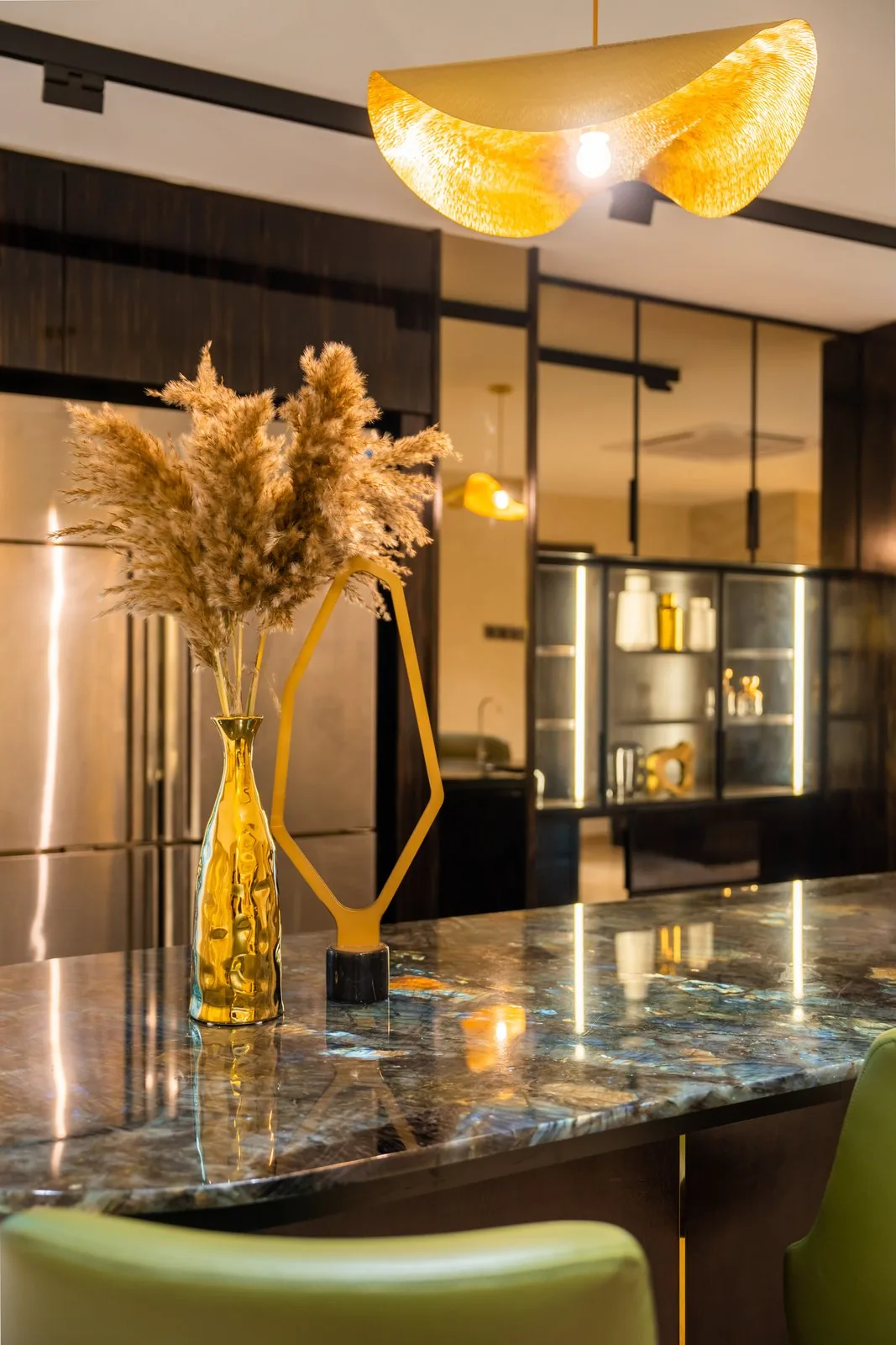 Close view of the veined stone countertop on a curved kitchen island in a Bangsar bungalow