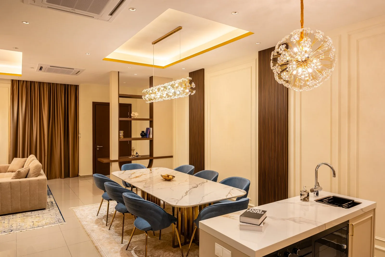 Kitchen island with a basin beside the dining table at Setia Safiro, Cyberjaya