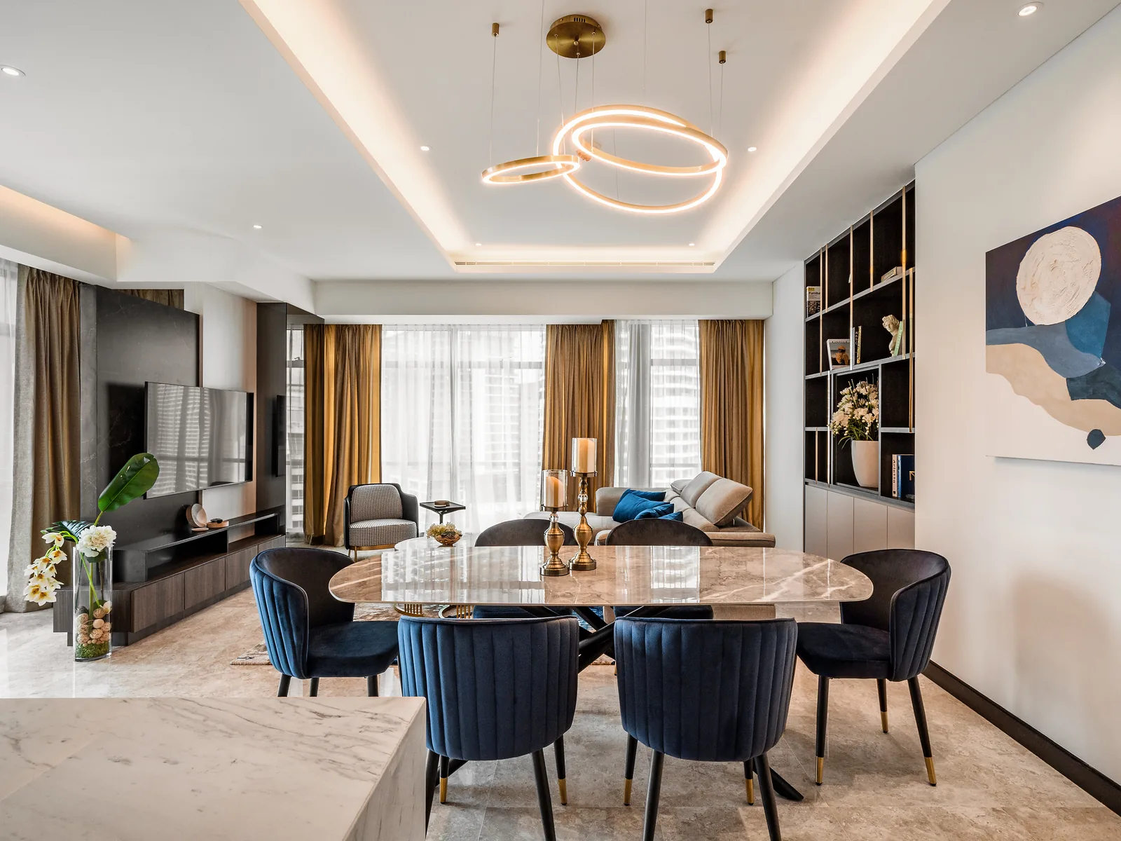 Ring pendant in a lit cove over a marble dining table at The Ritz-Carlton Residences show unit, KLCC