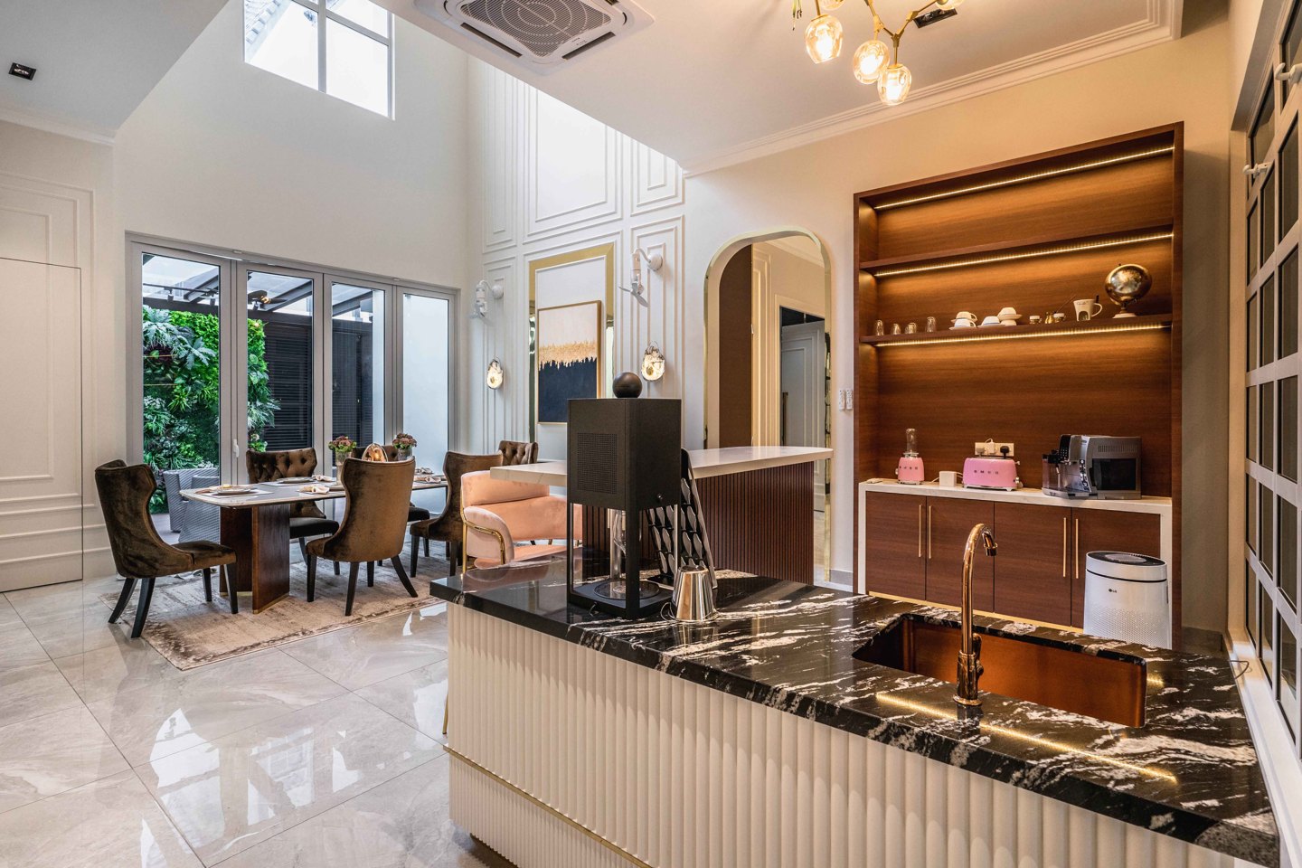Dry kitchen and coffee station with pendant lighting and backlit shelving in an EcoSpring landed home, by Blaine Robert Design