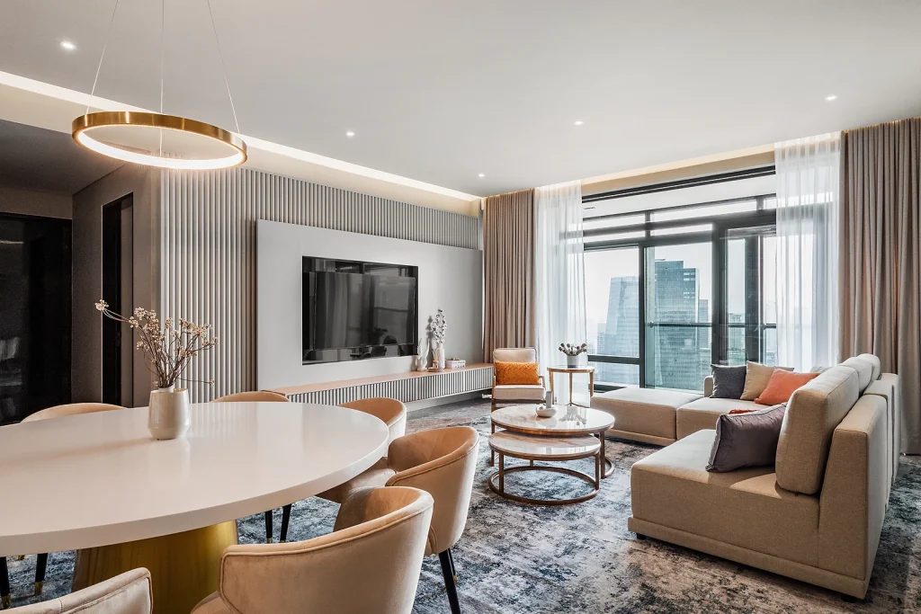 Luxury living and dining space with layered lighting at Four Seasons Residences, Kuala Lumpur, by Blaine Robert Design