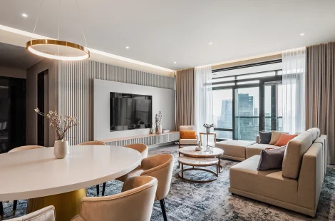 Luxury living and dining space with layered lighting at Four Seasons Residences, Kuala Lumpur, by Blaine Robert Design