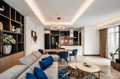 Living hall in warm neutrals and grey marble at The Ritz-Carlton Residences, Kuala Lumpur, by Blaine Robert Design