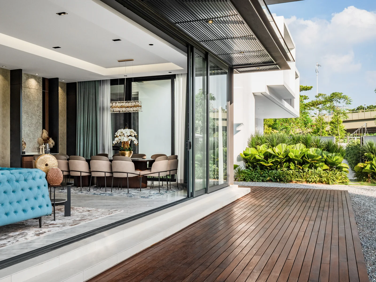 Indoor-outdoor living: the timber deck and dining space of the Kelana Jaya bungalow