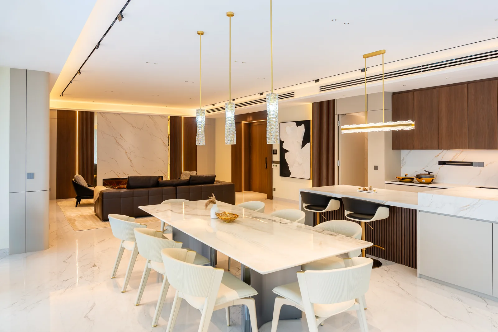 Kitchen island and dining table in one open contemporary space at Park Regent, Desa ParkCity