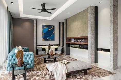 Modern living room with textured stone TV wall, teal armchair, marble side table and abstract art, Kelana Jaya bungalow