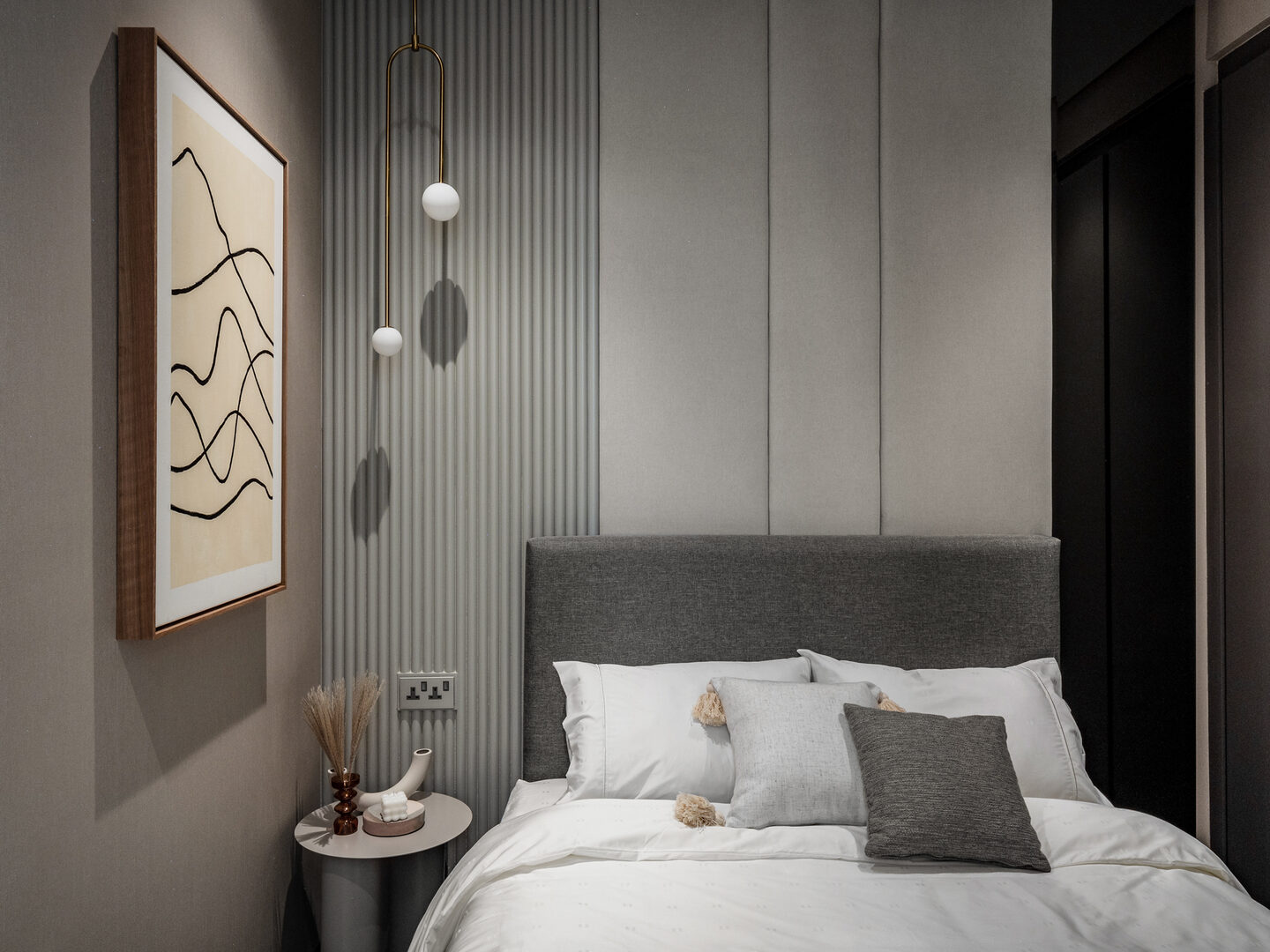 Monochromatic condo bedroom with fluted panelling and layered texture