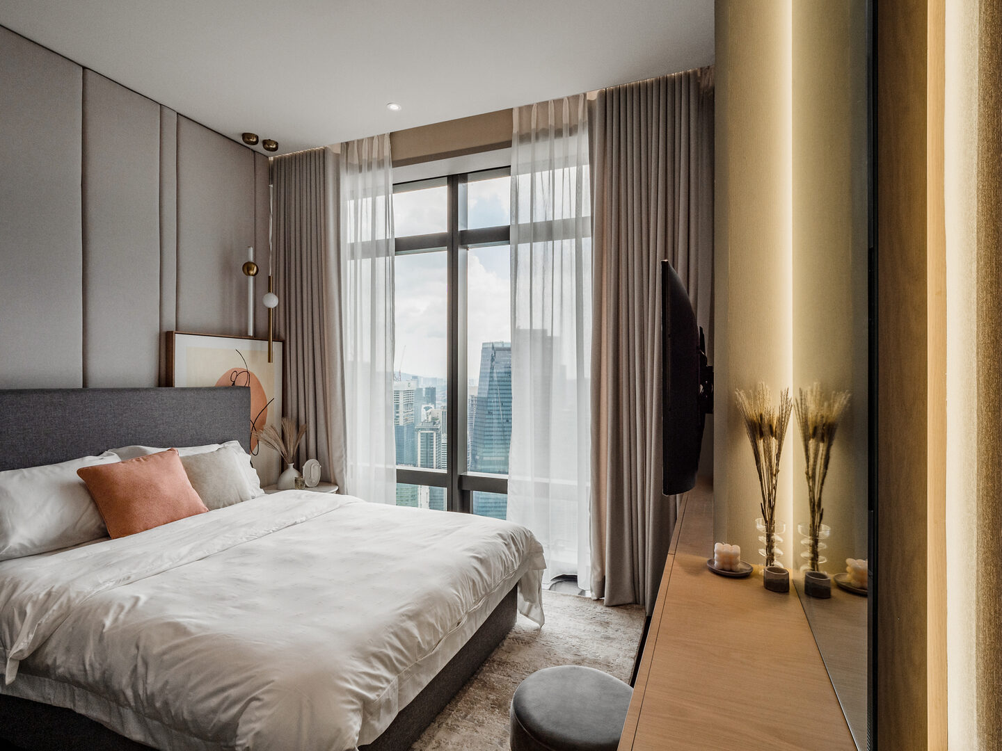 Condominium bedroom with unobstructed natural light beside full-height windows