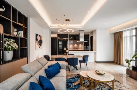 Living hall flowing into the dining area and open kitchen at the Ritz-Carlton Residences, Kuala Lumpur.