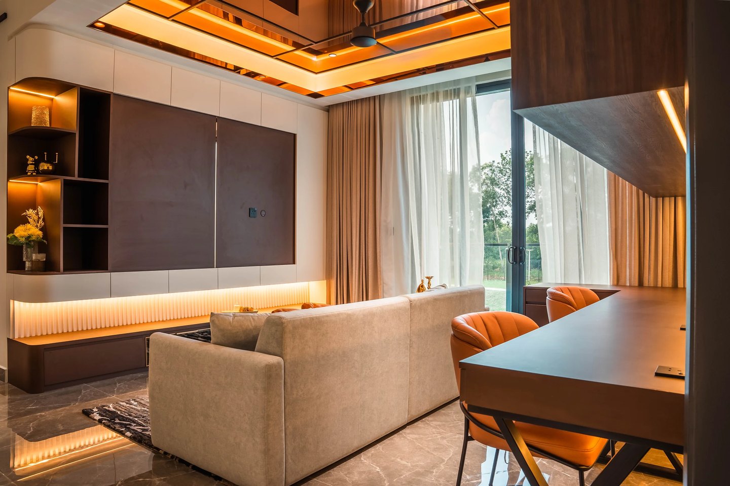 Upstairs lounge with dark timber media feature wall, backlit shelving and study desk at Setia Marina One