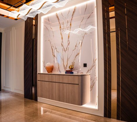 Backlit marble feature wall with gold veining behind a foyer console at Setia Marina One, Cyberjaya