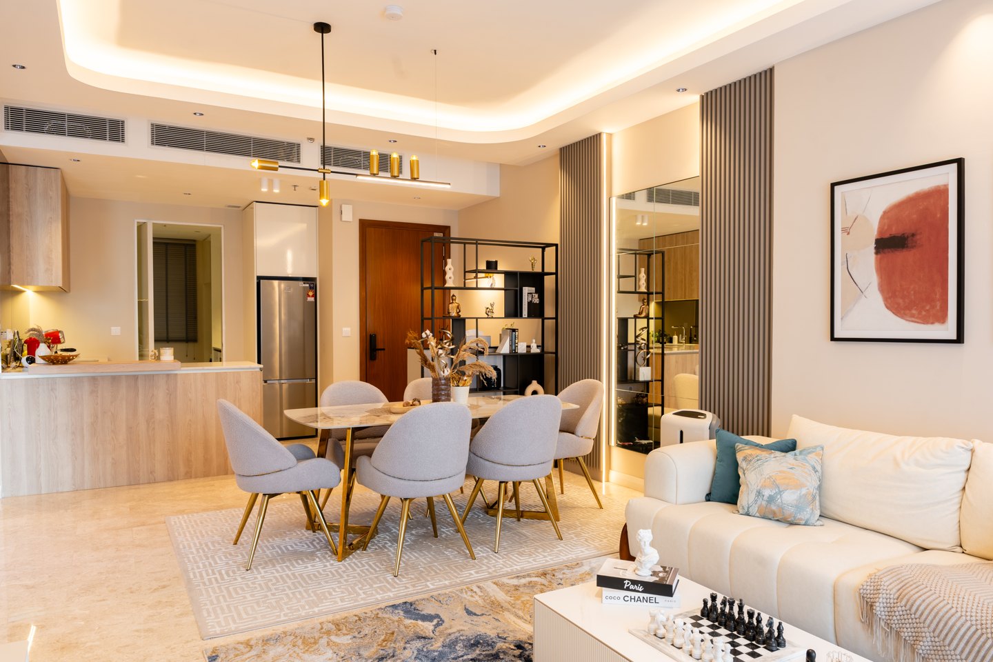 Compact open kitchen and dining area in a Kuala Lumpur condominium, designed by Blaine Robert Design