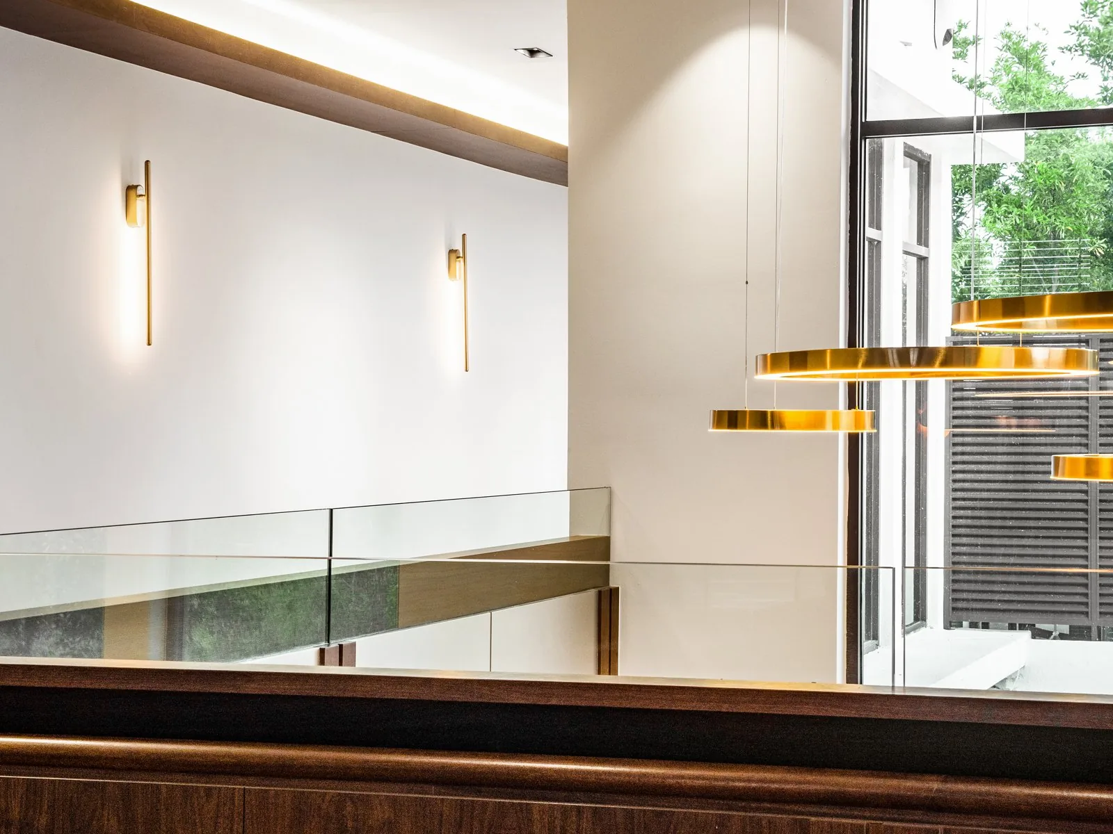 Glass balustrade along a double-height void at the East Coast Villa, Terengganu