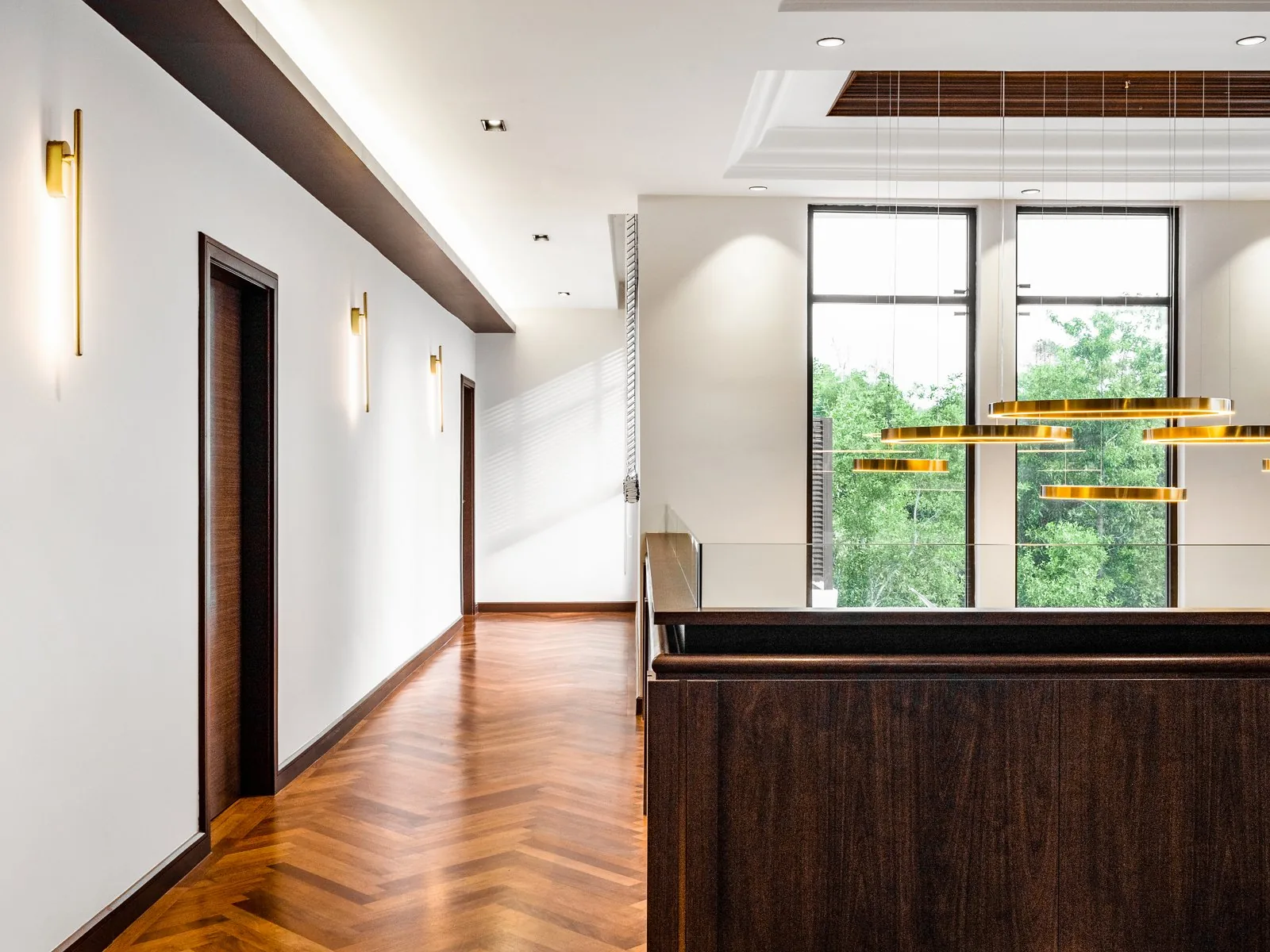 Upper corridor with a timber balustrade along the void at the East Coast Villa