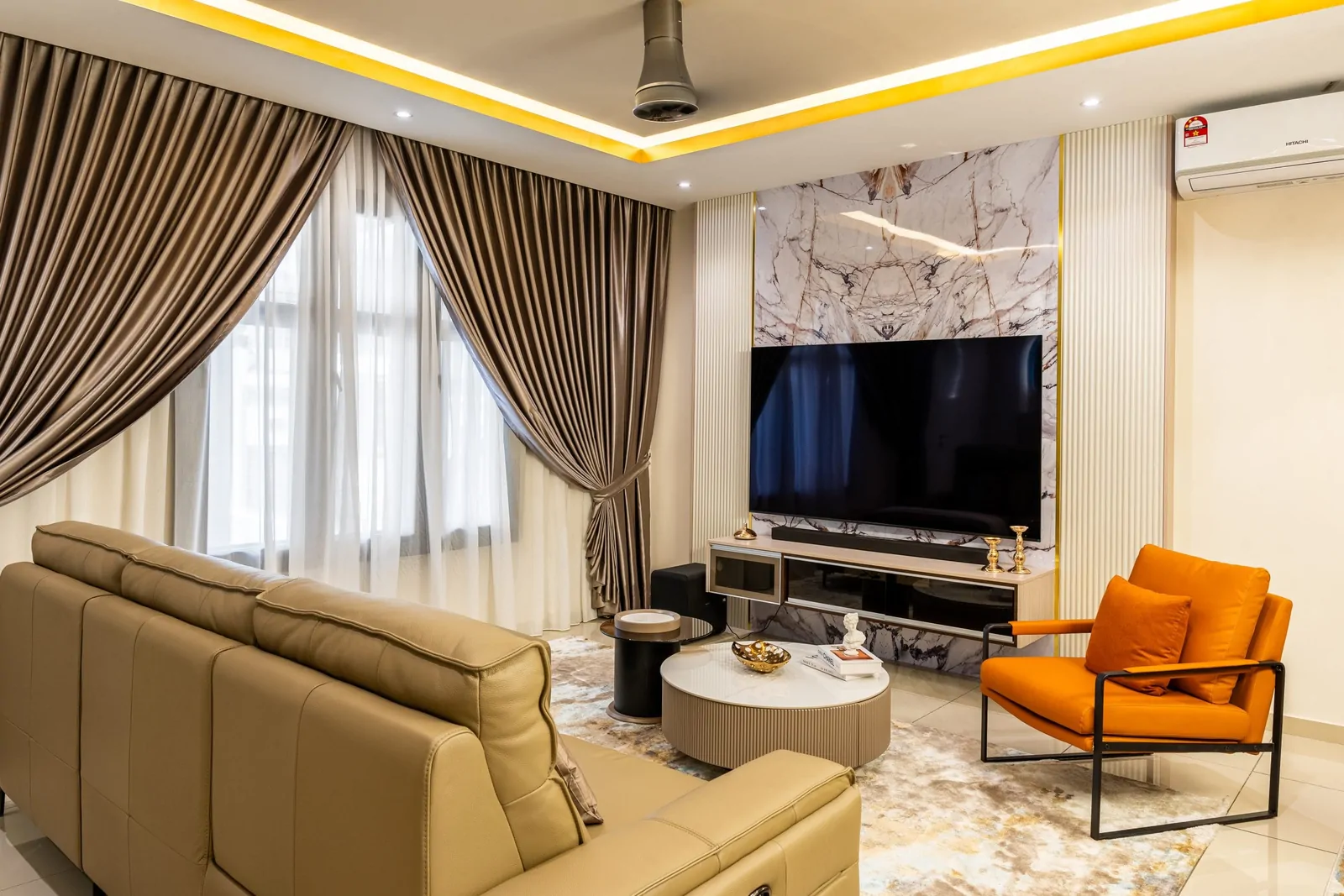 Terrace house living room with full-height curtains, a leather sofa and an accent armchair, Serimba Residence, Kajang