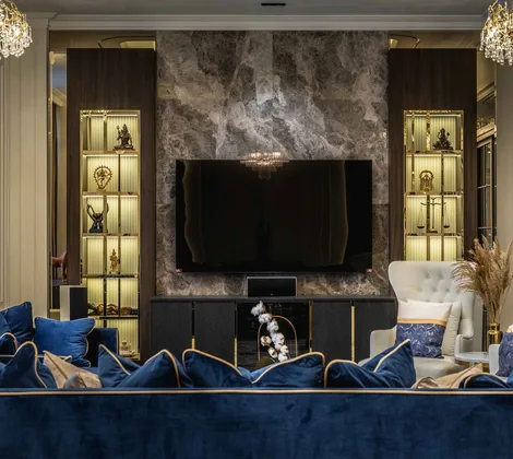 TV cabinet design with a grey marble TV wall and lit display niches in the living room at EcoSpring, Johor Bahru, by Blaine Robert Design