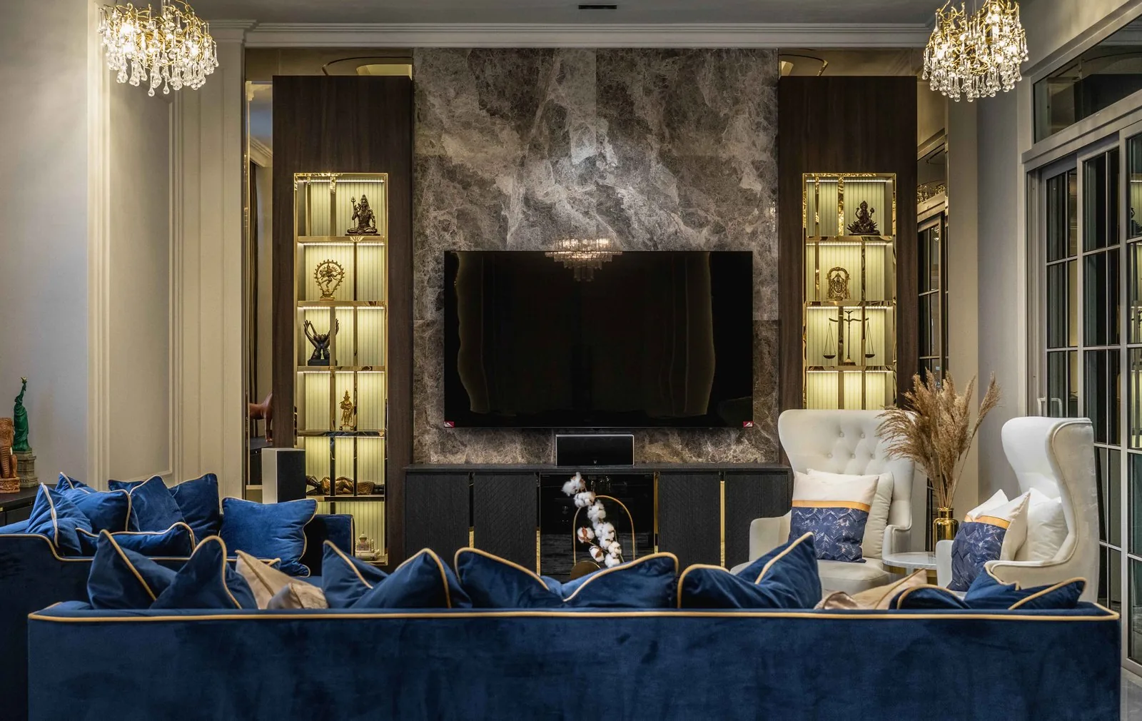 TV cabinet design with a grey marble TV wall and lit display niches in the living room at EcoSpring, Johor Bahru, by Blaine Robert Design