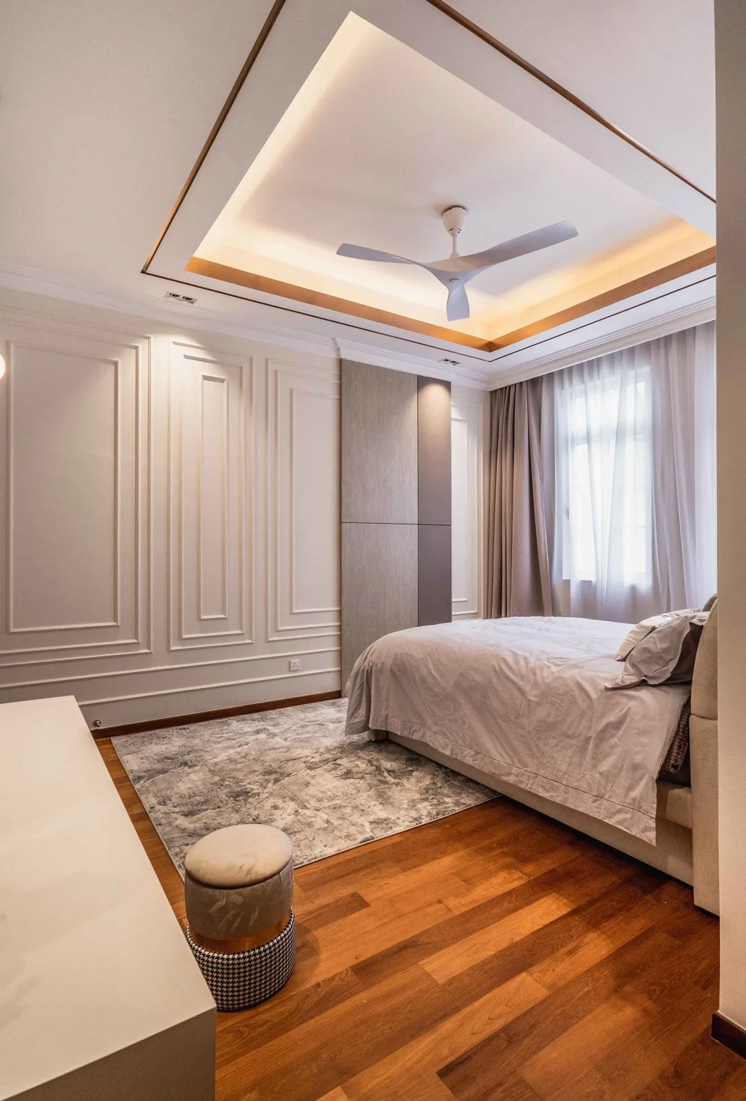 Bedroom with full-height wainscoting panels at EcoSpring
