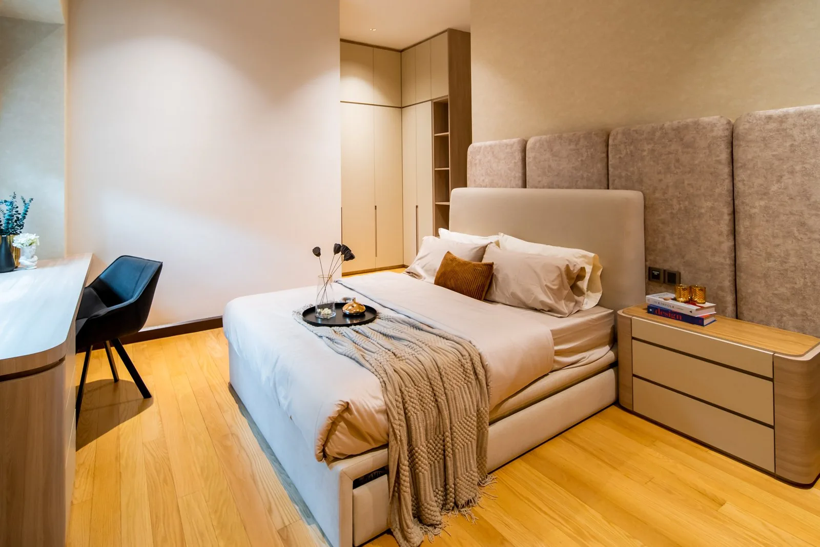 Built-in wardrobe beside the bed in a guest bedroom of a Bangsar bungalow, with a study desk by the window