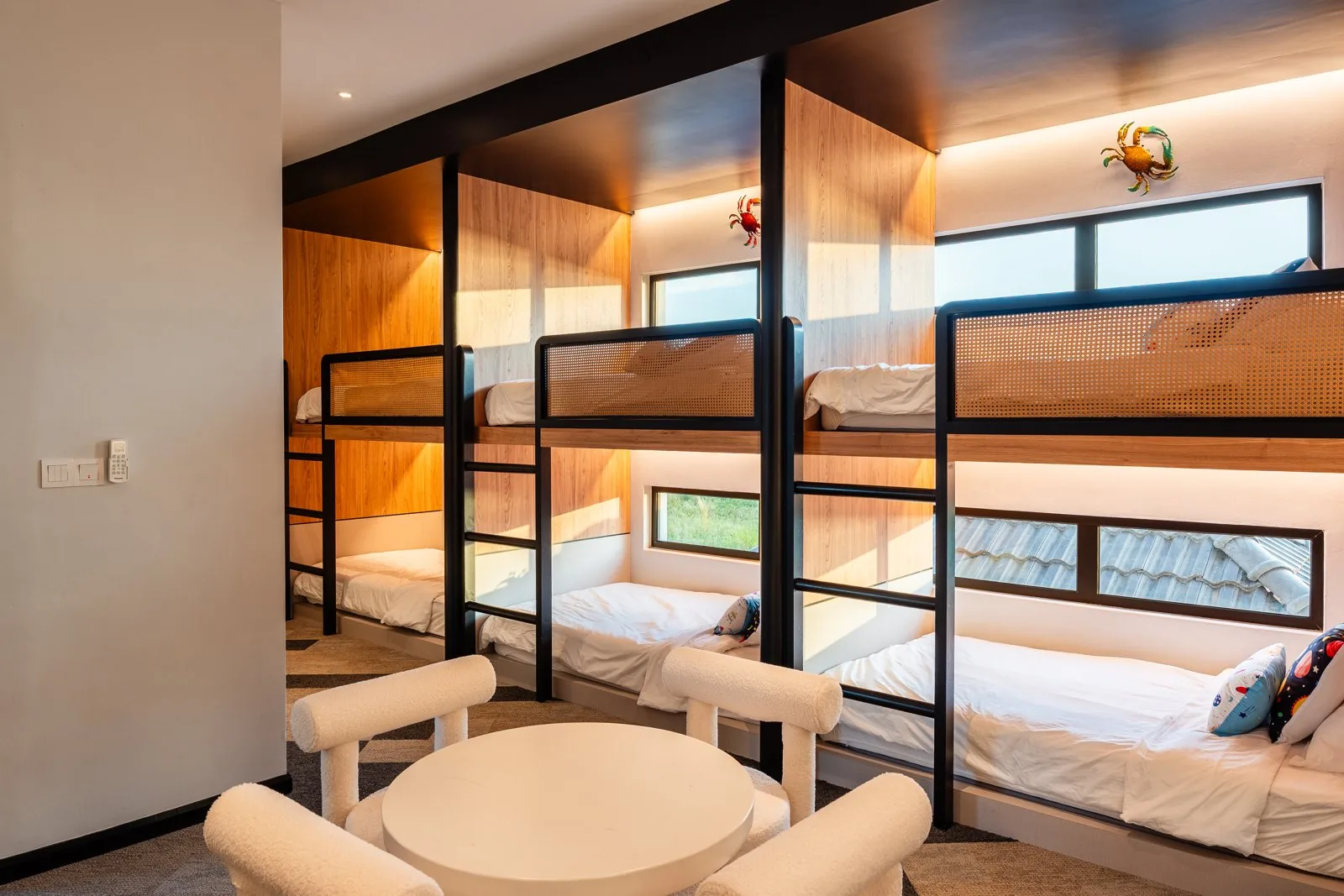 Guest room with built-in bunk beds and timber joinery at Quayside Villa, Port Dickson