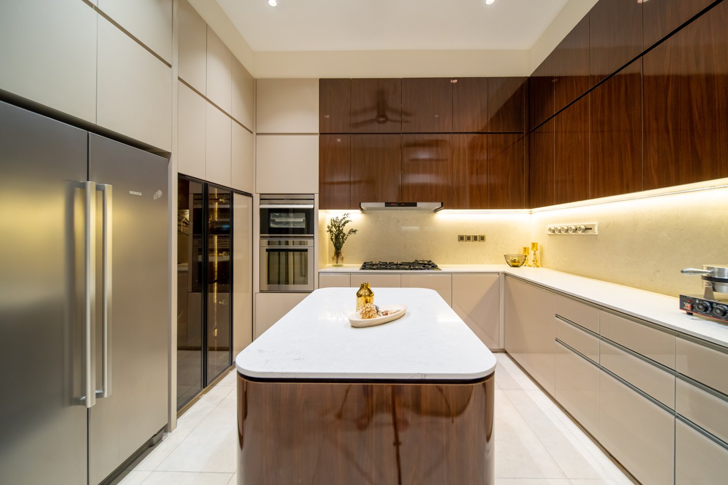 Wet kitchen with white cabinets, timber accents and a full-height fridge in a Bangsar bungalow, designed and built by Blaine Robert Design